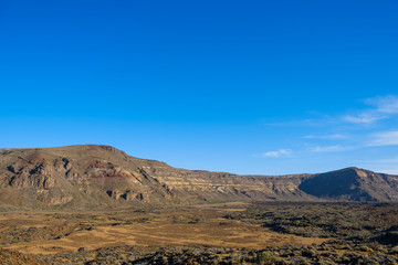 desert valley in mountain landscape , clear blue sky background