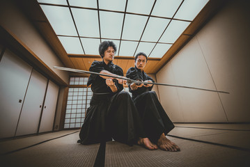 Samurai training in a traditional dojo, in Tokyo