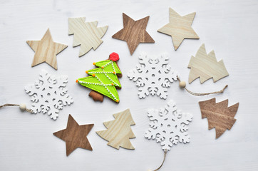wooden christmas trees, snowflakes, stars and baked ginger cookies, top view