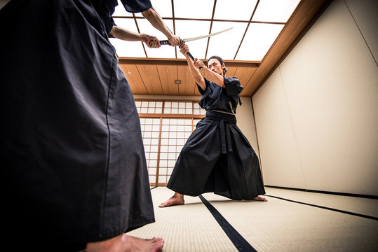 Samurai training in a traditional dojo, in Tokyo