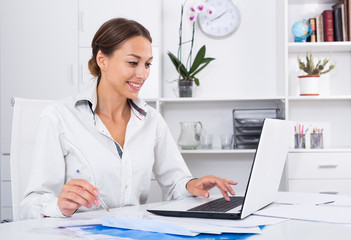 woman writing down information