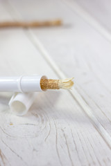 Miswak or siwak - arabian toothbrush for tooth cleaning on white.
