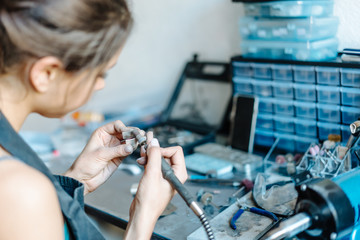 The girl is engaged in jewelry business