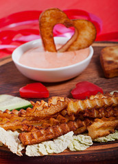 French fries and vegetables cut into the heart. Valentine's Day