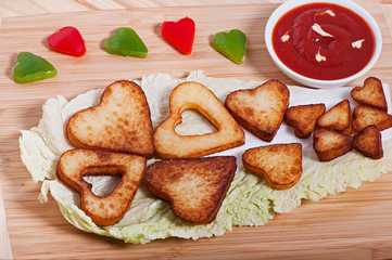 French fries and vegetables cut into the heart. Valentine's Day