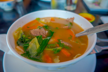 Close up of traditional Nepali and healthy soup served in a white bowl plate in Nepal
