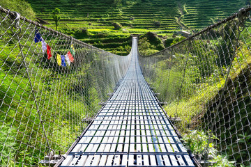 suspension metal bridge in trekking annapurna in himalayas. nepal.
