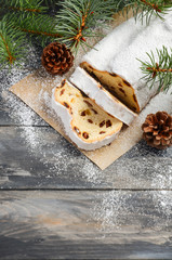 Christmas Stollen. Traditional German, European Festive Dessert. Holiday Concept Decorated with Fir Branches. 