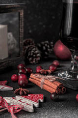 Mulled wine, hot drink with spices on a black background, wine, alcohol, winter, snow
