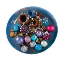 Colorful Christmas Decoration in a Plate on white background