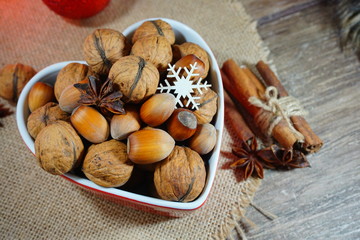 Fototapeta na wymiar Nuts and spices.Christmas time. At the holiday table 