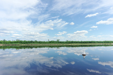 River view with clouds reflected in it, Volga, Russia