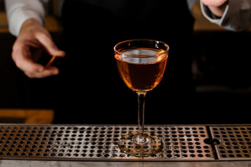 Elegant glass filled with light alcoholic drink