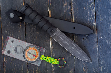 A large knife with a fixed blade with compass. Military bayonet-knife. Top view.