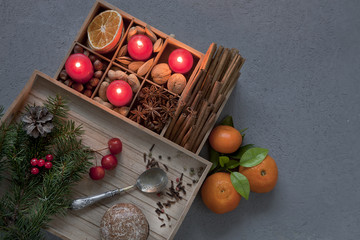 Mixed fruit nuts and Christmas spices. Advent candles. Christmas decor, top view, close-up. Christmas concept. Background