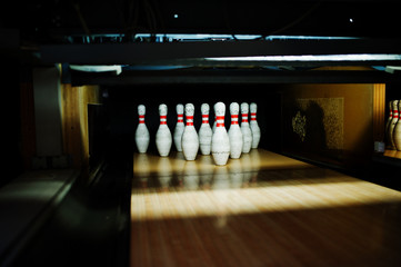 Close up of ten pins at bowling club.