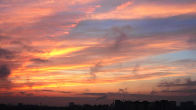 Dramatic sunset in Voronezh city timelaps, colorful clouds and smoke from chimneys over cityscape, toned