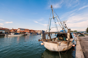 Fototapeta na wymiar Fishing boats moored in harbor.