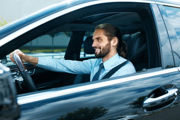 Man Driving Car. Portrait Of Smiling Male Driving Car