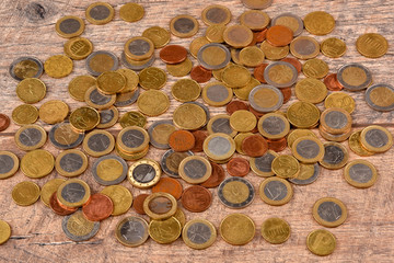 European money.Background of coins.Good earnings.Big profit.Money supply.Coins are scattered on the table.