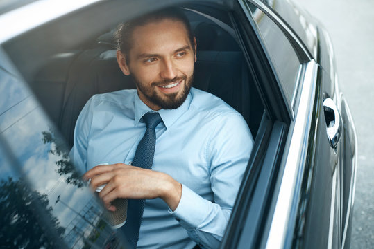 Man Drinking Coffee In Car Portrait