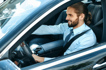 Man Driving Car. Portrait Of Smiling Male Driving Car