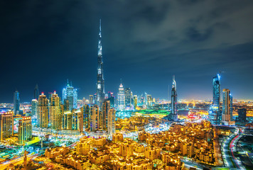 Dubai skyline at sunset with beautiful city center lights and Sheikh Zayed road traffic, Dubai,...