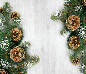 Fototapeta na wymiar Christmas and New Year's composition. The pine cones, spruce branches on a wooden white background