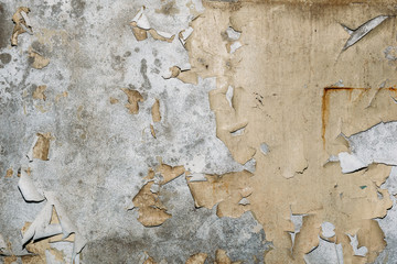 Vintage grunge background texture of old concrete wall with cracked weathered paint and traces of water streaks