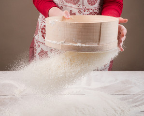 Sifting flour with flour filter. Making cookies A chef making cookies. The first step in cooking...