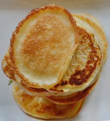 Golden Home-made Pancakes, Stacked on a White Plate