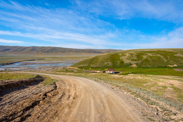 Fototapeta na wymiar Road over Kyrgyz countryside