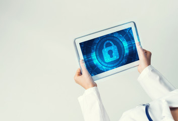 Close of female doctor hands working with tablet pc computer