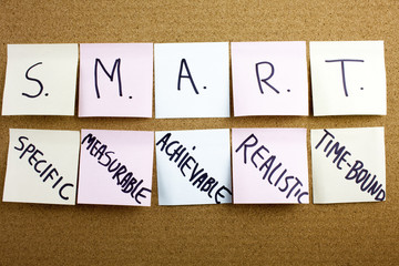 caption, inscription Phrase SMART in black ext on a sticky note pinned to a cork notice board...