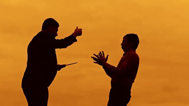 businessman discussion sunset silhouette sunlight standing evil boss clipboard concept. two businessman men swearing outdoors conflict fight looking at slow motion video