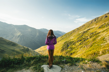Obraz premium Outdoor close up portrait stylish hipster girl behind amazing mountains landscapes,girl in sportswear, sexy model, girl hiking