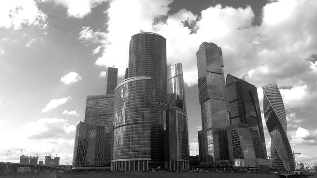 skyscrapers on river bank in summer black and white timelapse
