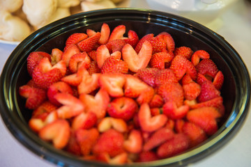Close-up the strawberry in a plate on the table in the restaurant