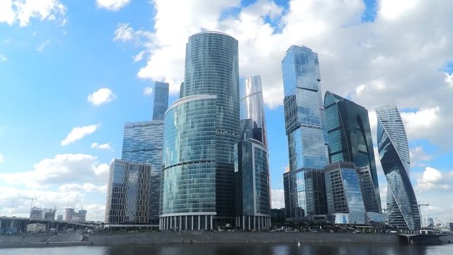 skyscrapers on the river bank in summer timelapse