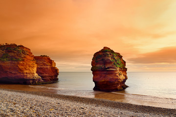 Impressive red sandstones of the Ladram bay on the Jurassic coast, a World Heritage Site on the...