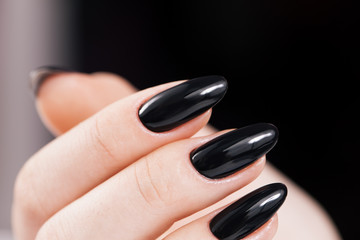 Black nails design close-up.