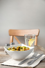Bowl with roasted brussel sprouts on table