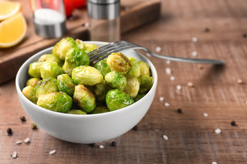 Bowl with roasted brussel sprouts on table
