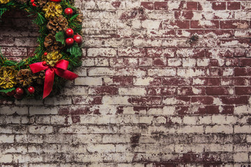 christmas wreath on  brick wall background