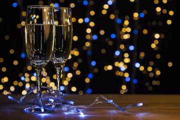 Flutes of champagne with Christmas lights