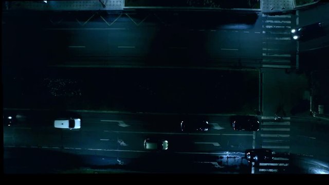 Aerial street view with cars passing by