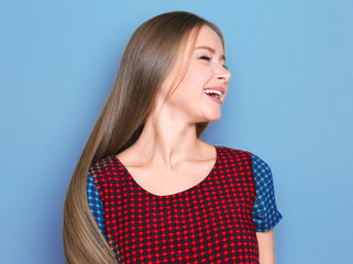 Beautiful young smiling woman on color background