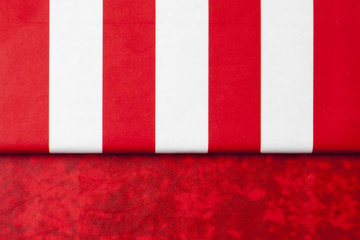 Present lid on red texture