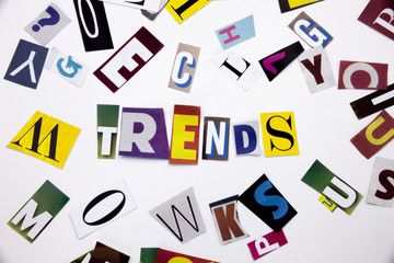 A word writing text showing concept of TRENDS made of different magazine newspaper letter for Business case on the white background with copy space