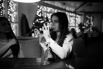 The girl in the evening in a cafe 